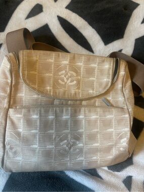 CHANEL Beige Quilted Crossbody Bag with Logo Motif